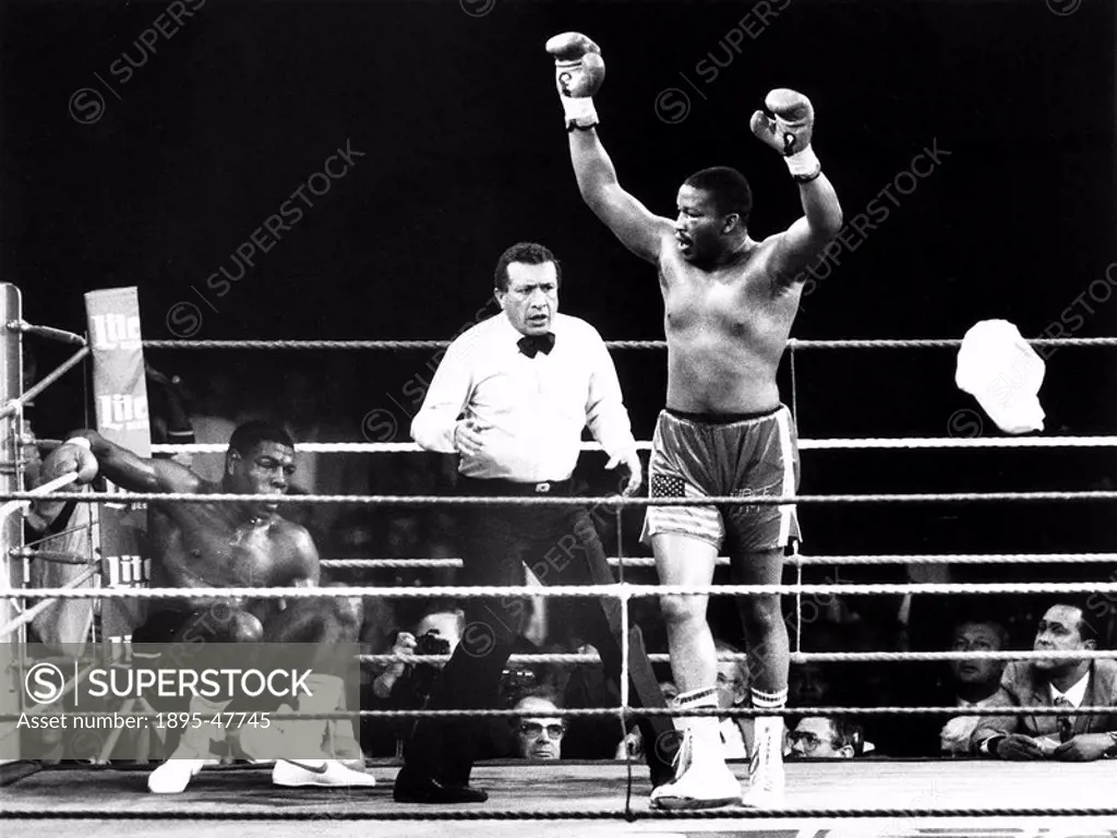 Witherspoon and Bruno, 20 July 1986 American boxer Terrible’ Tim Witherspoon knocks down British hope Frank Bruno during the title fight - Bruno lost...