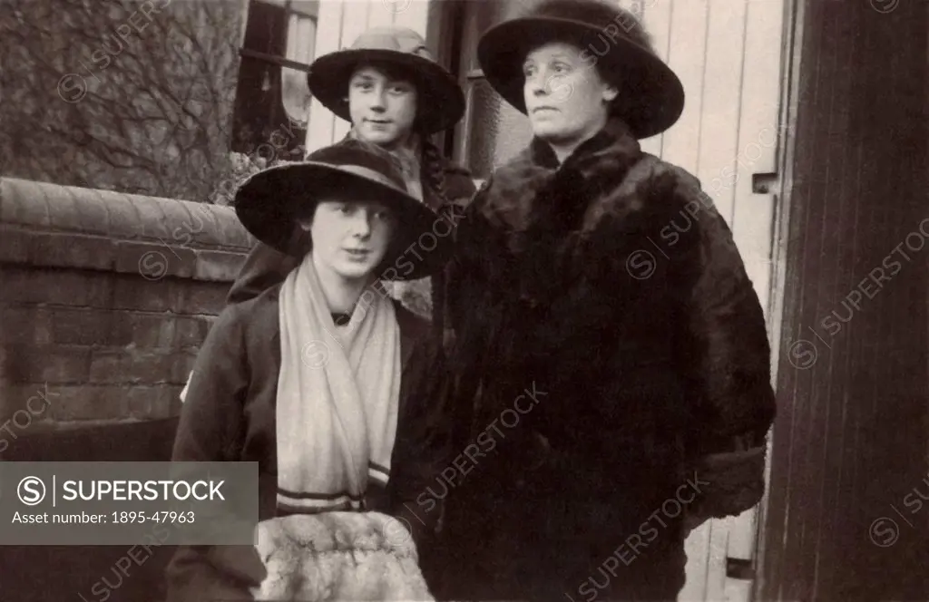 Mother and her two daughters, England, 1915.Women in winter clothes with fur coats and muffs.