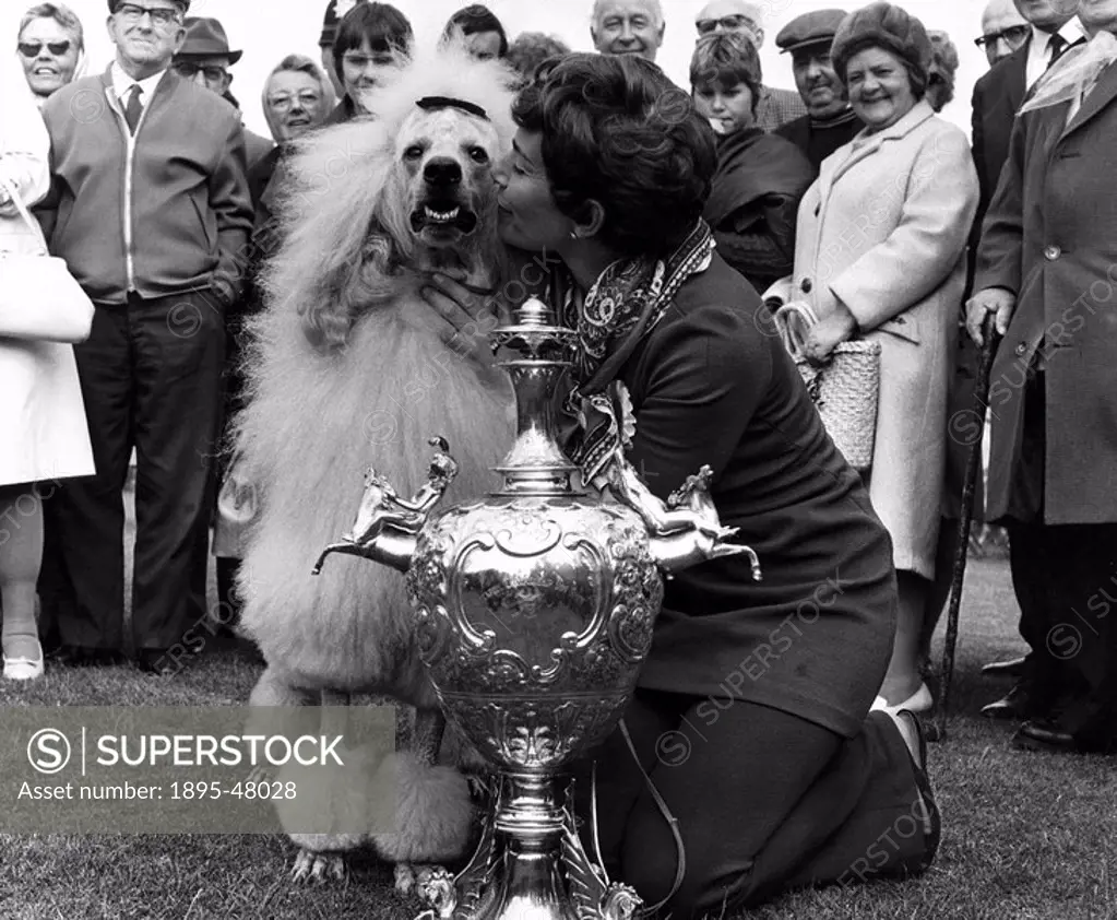 Winner of the Blackpool Dog Show, 25 June 1970.Best dog of the show, champion Alpenden Golden Sand’ with trophy and proud owner Vivienne Kellard.