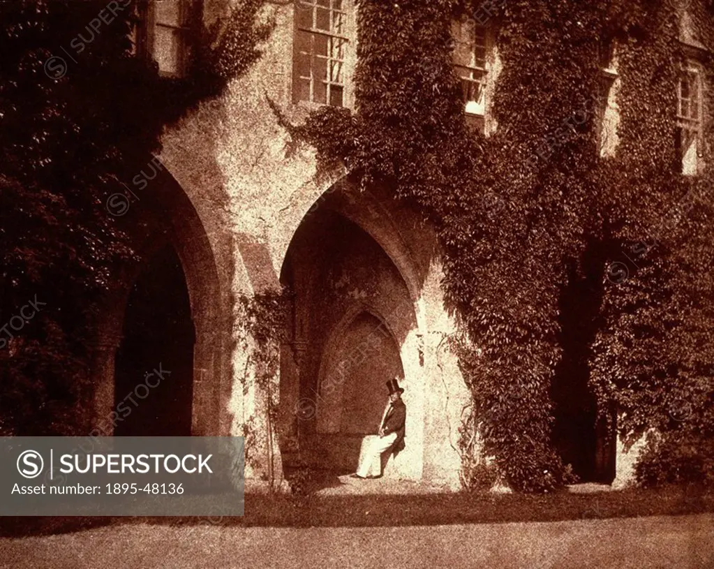 The Reverend Calvert Jones in the cloisters of Lacock Abbey, c 1843. Calotype by William Henry Fox Talbot 1800_1877. Fox Talbot invented the negative/...