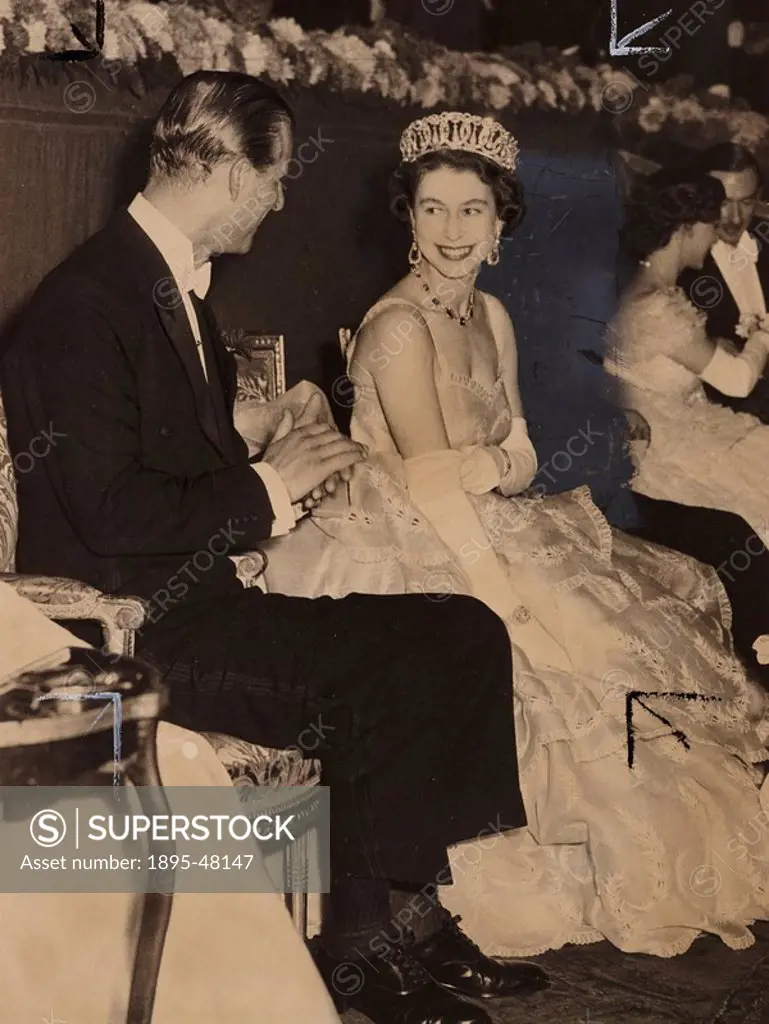 Queen Elizabeth and Prince Philip at the Royal Film Show, 1953.Gelatin silver print. A photograph of Queen Elizabeth and her husband the Duke of Edinb...