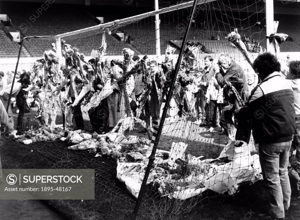 Flowers in the goal, April 1989.On 15 April 1989, 96 football fans _ men, women and children _ were crushed to death during a rush to get into the Hil...