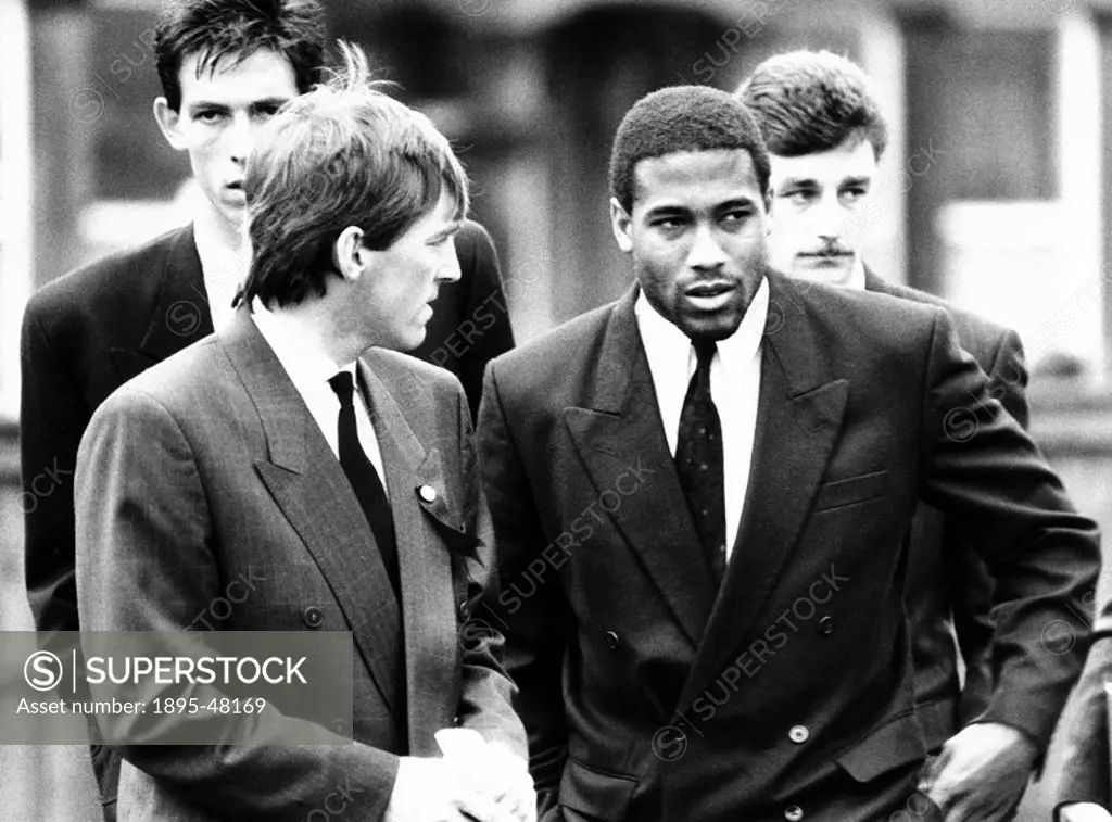 Kenny Dalglish and John Barnes at a fans funeral, Liverpool, 19 April 1989.Liverpool players attending the funeral of a fan killed in the Hillsboroug...