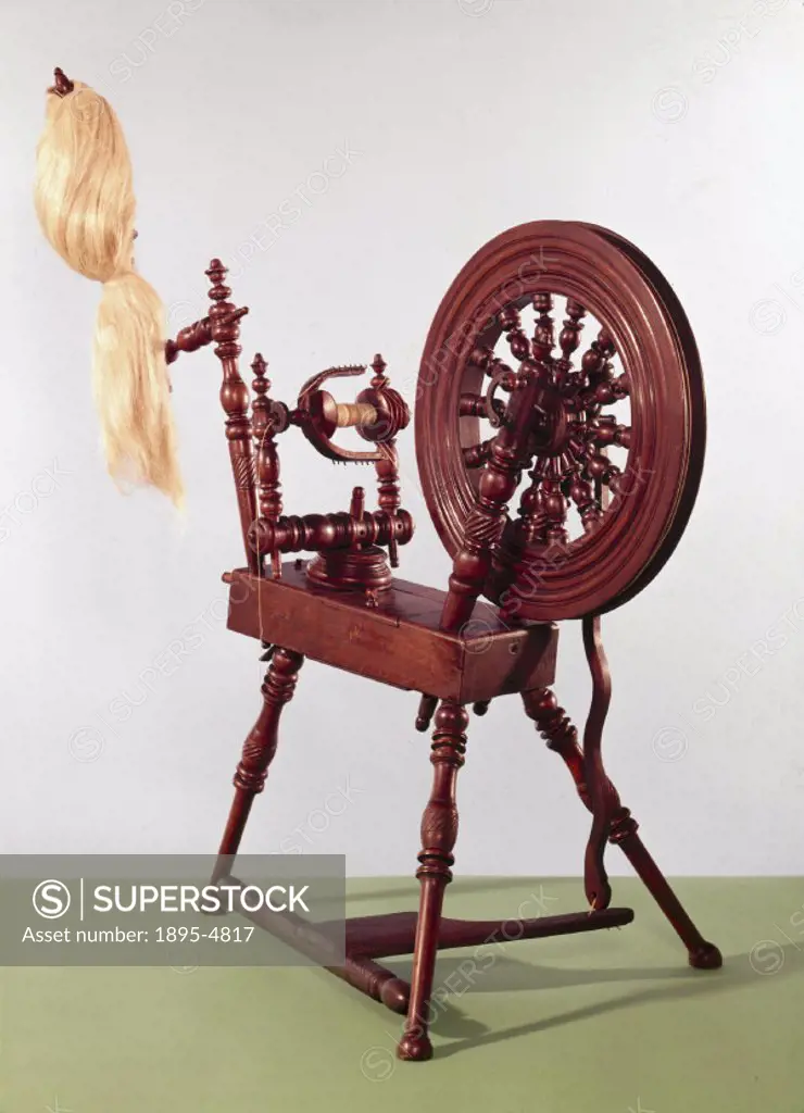 This small wooden spinning wheel is designed to wind the thread onto the bobbin as fast as it is spun so that it operates continuously. This type of w...