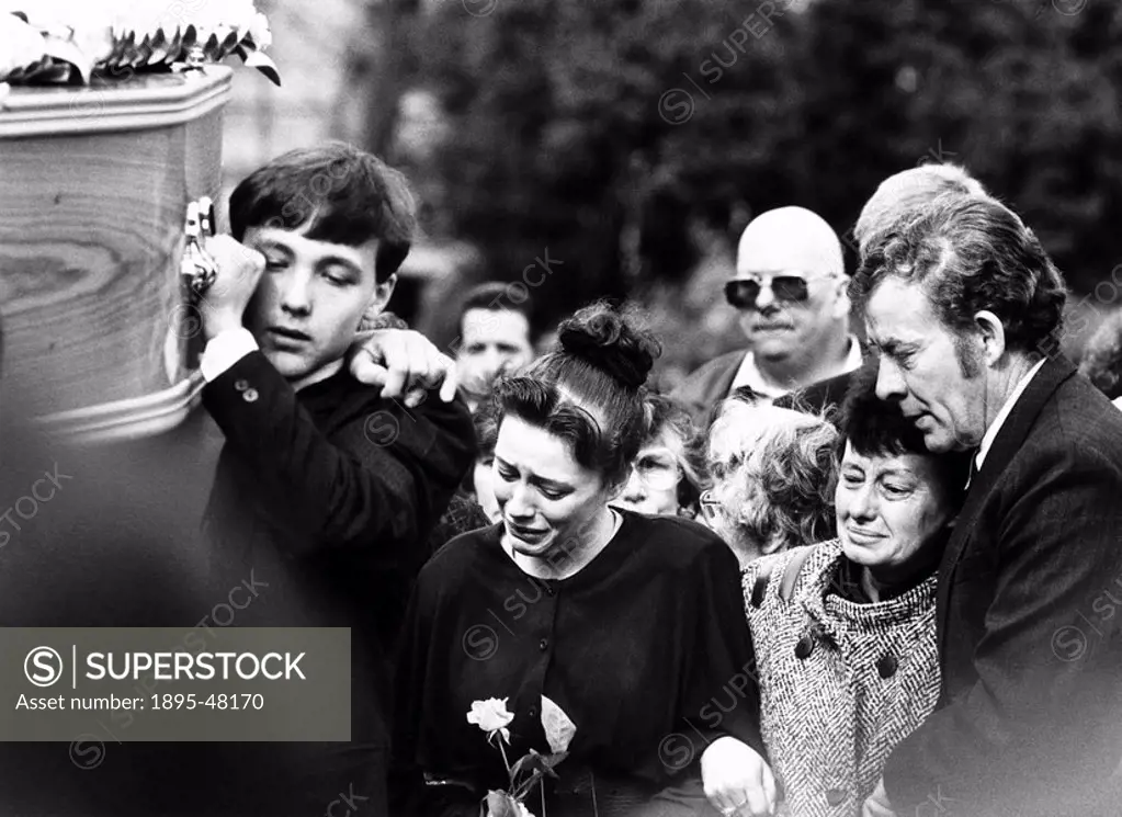 Funeral of a fan killed at Hillsborough, 19 April 1989.Dave and Maureen Church, the parents of Gary Church 19, in tears as they watch his coffin being...