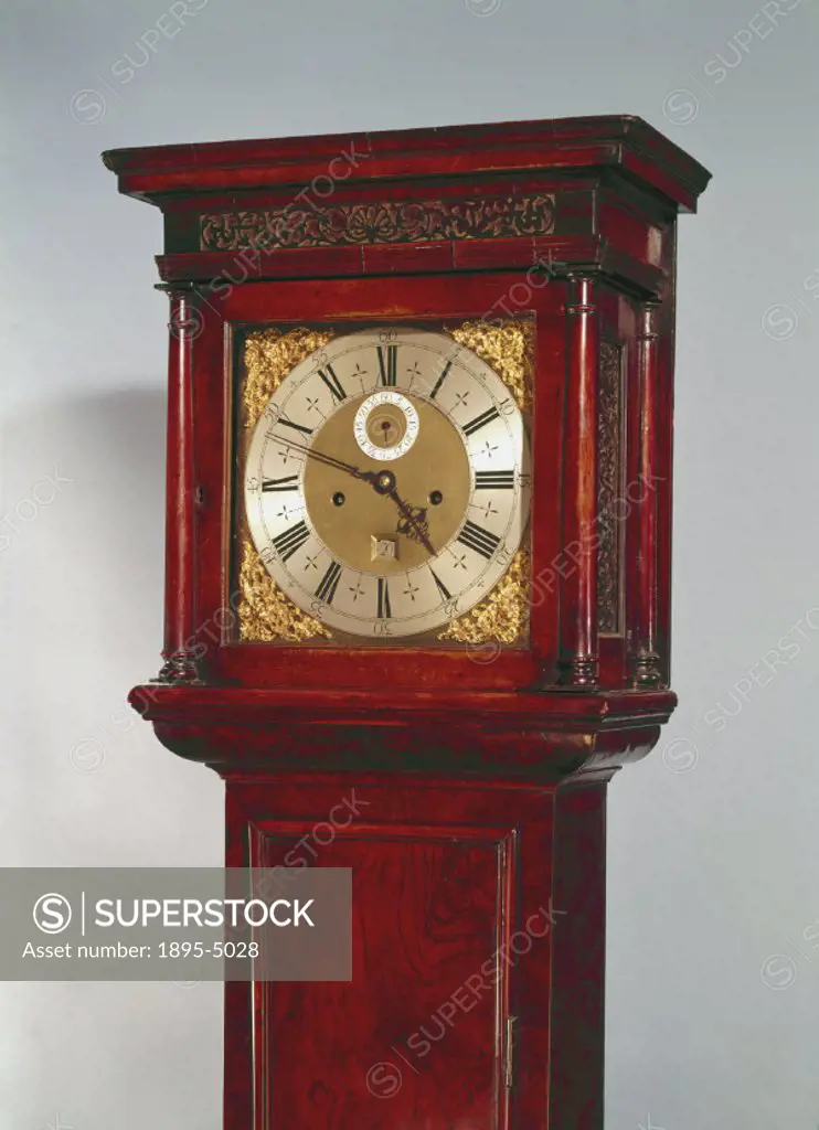 Detail of hood and dial. This long case clock in a walnut case was made by Thomas Tompion (1639-1713), one of the finest English clockmakers. Long cas...