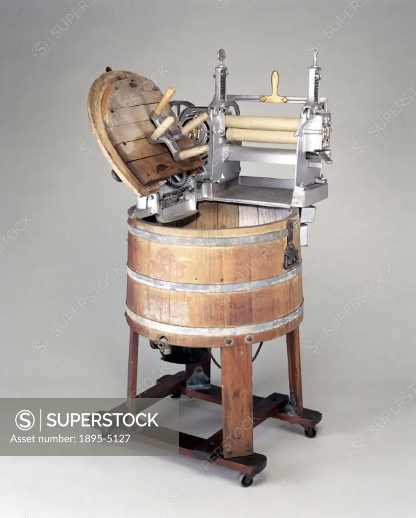 Electrically driven, with a mangle made by Beatty Bros of Canada. This interesting machine shows how electricity was first used to drive a hand-operat...