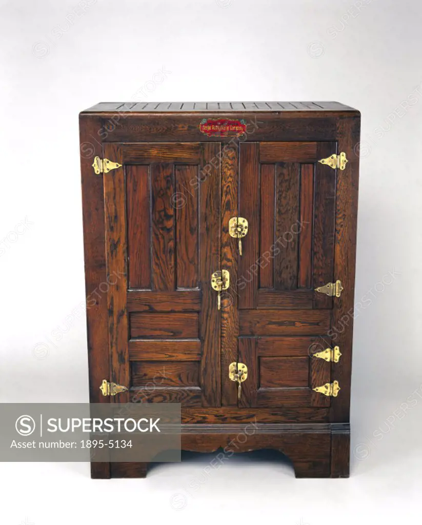 Dry-air syphon refrigerator made by the Seeger Refrigerator Company of St Paul, Minnesota, USA. Food placed in this wooden zinc-lined insulated ice bo...