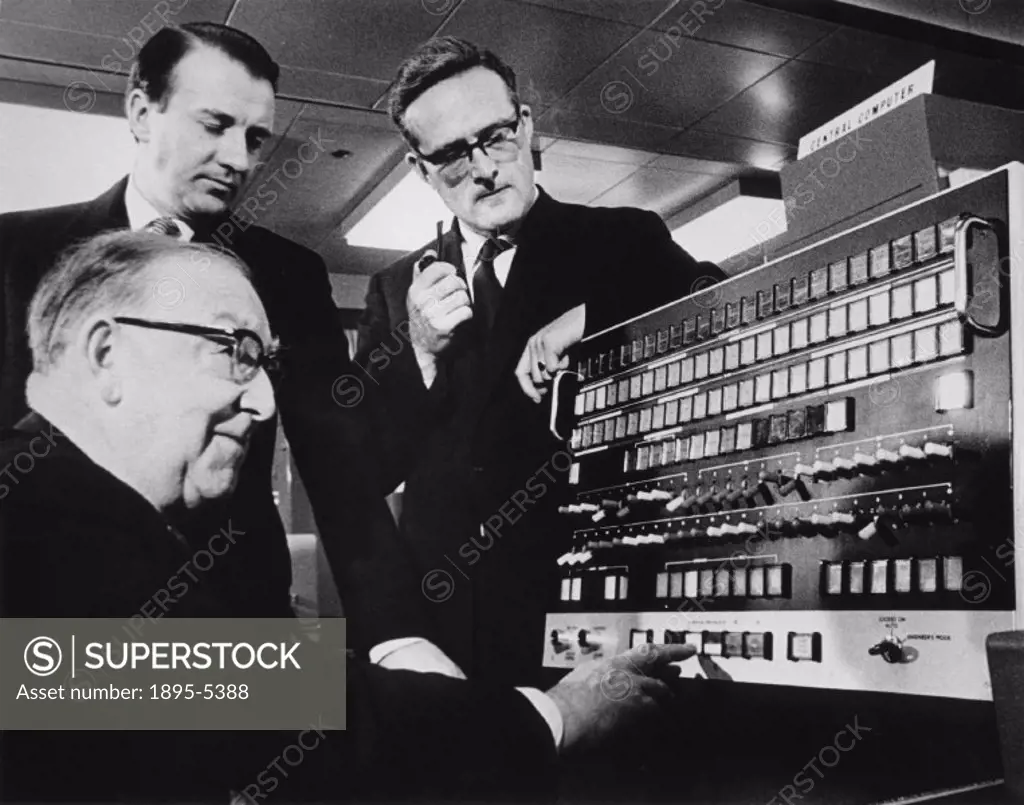 Sir John Cockcroft (1897-1967), English nuclear physicist. ´Inauguration of the Atlas Electronic Computer. Sir John Cockcroft sets the computer into a...