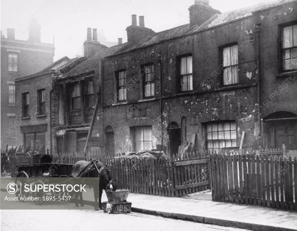 75,000 pounds for Britain´s Biggest Slum Clearance Scheme. A dilapidated row of shop houses in Old Bethnal Green Road, London, in the area to be rede...