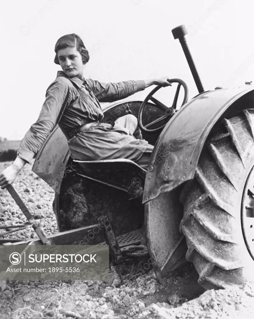 ´Girls are being trained in agriculture at the Farm Institute at Sparsholt near Winchester in Hampshire. Photograph shows a modern land girl, who is m...