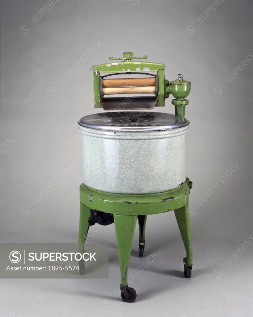 Washing machine and wringer, of unidentified make. The first electric washing machine was invented between 1906 and 1908 by the American Alva J Fisher...