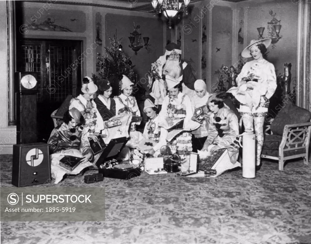 Attendants at the Regal Cinema in Marble Arch, London, handing gifts to Father Christmas for distribution to a hospital charity´. Photograph by Cardew...