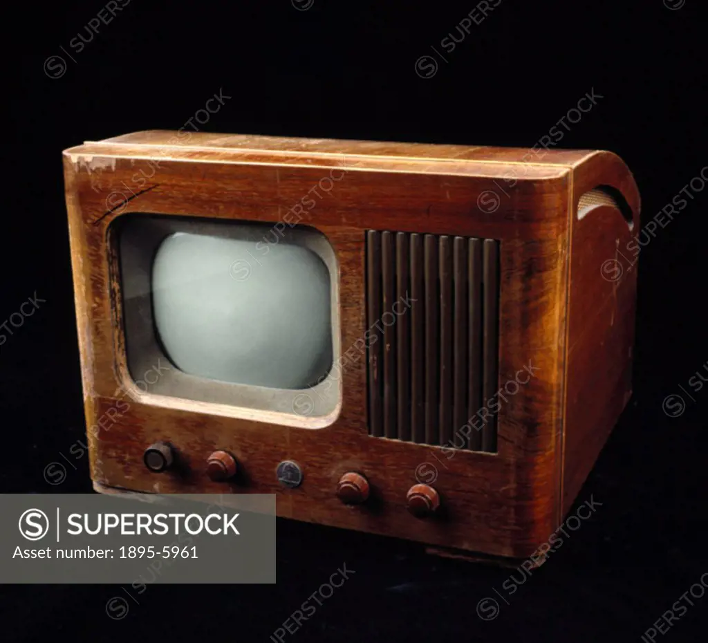This table model receiver in walnut casing has a nine inch screen. Television broadcasts resumed in Britain on 8 June 1946 and during the post-war per...