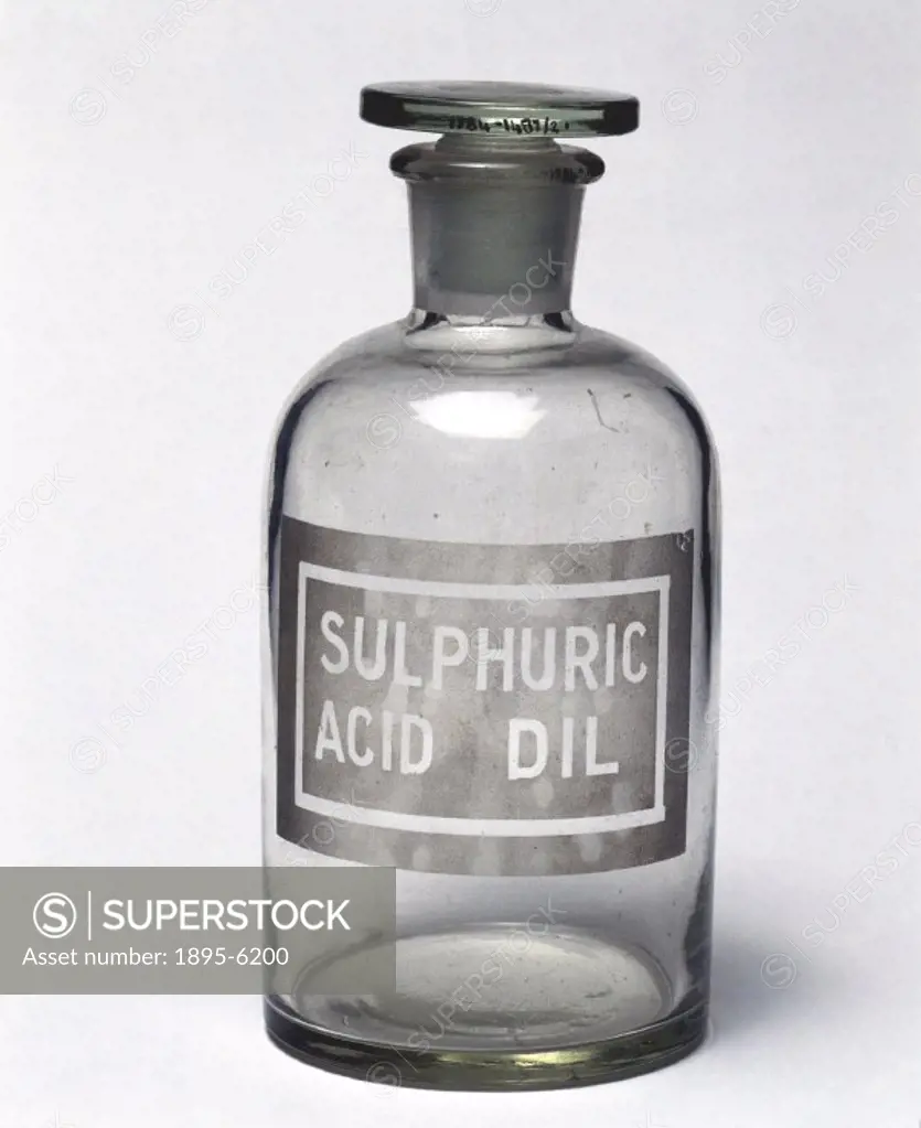 Reagent bottle with a ground glass stopper and sand blasted label reading ´sulphuric acid dil´ (dilute sulphuric acid). A reagent is a substance or mi...