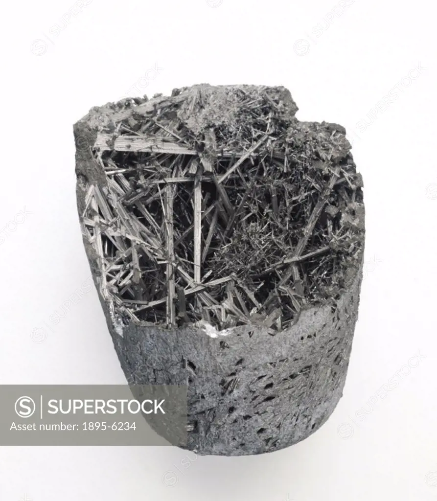 The thin, pointed crystals are alloys of copper and aluminium. The outer part was cooled quickly and few crystals were formed. An intermetallic compou...
