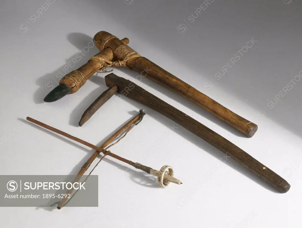 Primitive hand axe (top), fragging stick (middle) and bow drill (bottom). The reversible axe on adze, dating from c 2000 BC has a greenstone blade tha...