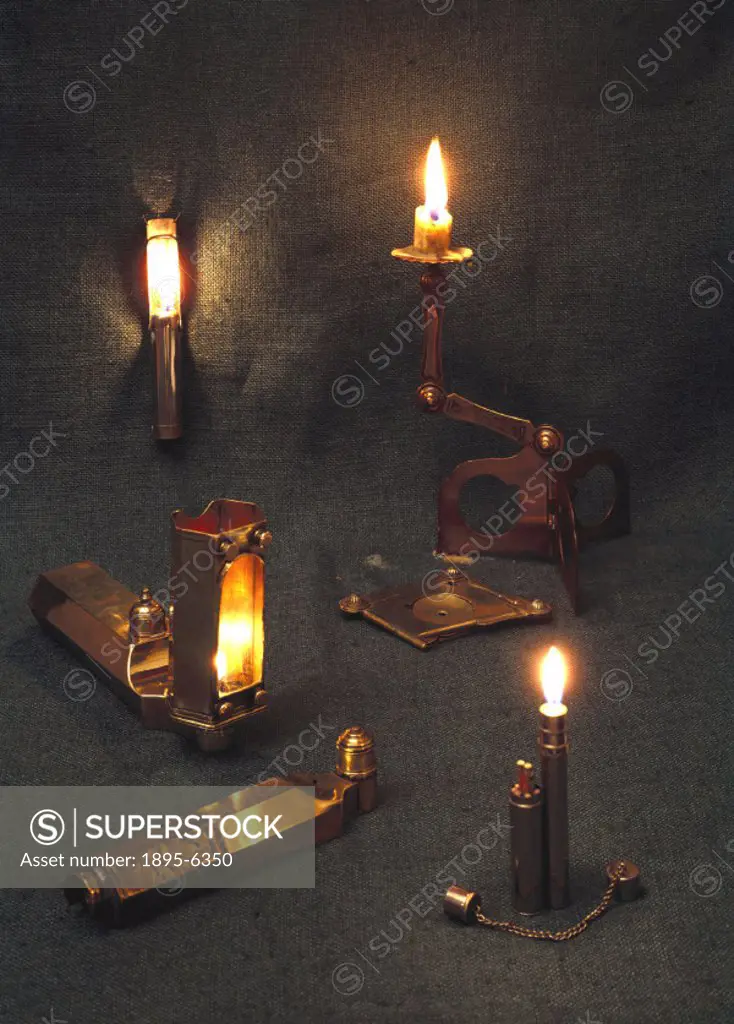 These portable oil lamps and candle holders can be folded into a small space for easy carrying. Bottom left are two examples of a type of oil lamp dat...