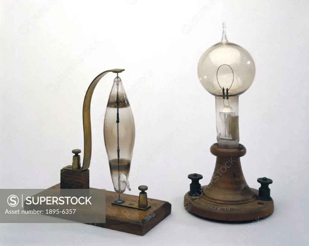 The lamp on the left is an early carbon and rod filament incandescent electric lamp made by the English chemist, Joseph Swan (1827-1914) in 1878-1879....