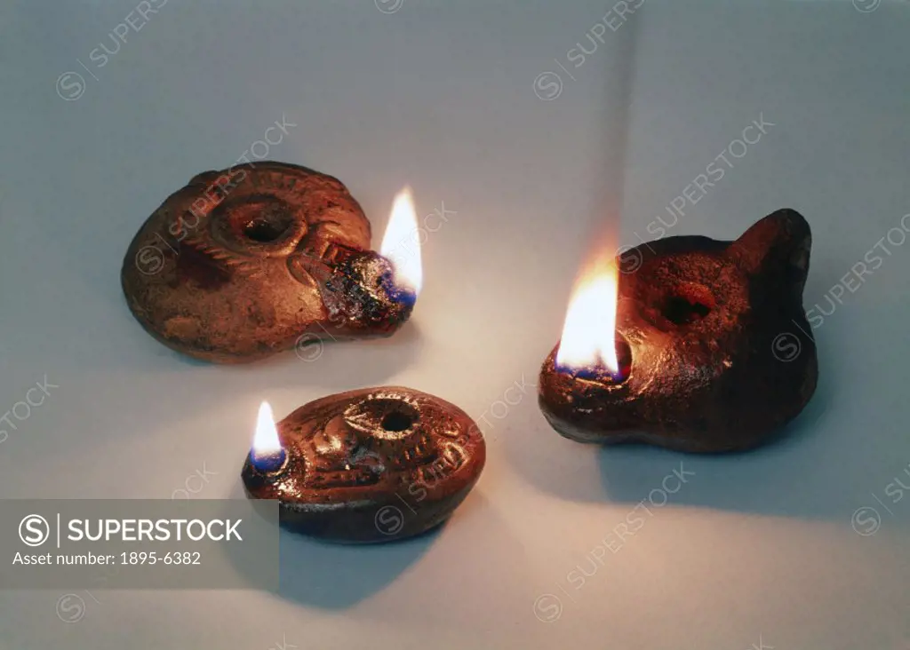 These lamps are approximately 2,000 years old. Oil was used to fuel the earliest lamps such as the simple ceramic ones shown here. These examples illu...