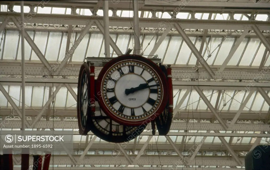 Station clock with four faces suspended from the roof within Waterloo Station.