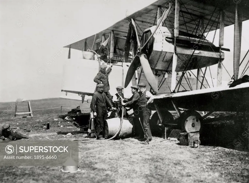 Photograph showing the aircraft being fuelled after reassembly in Newfoundland, Canada. Sir John William Alcock (1892-1919) and Sir Arthur Whitten Bro...