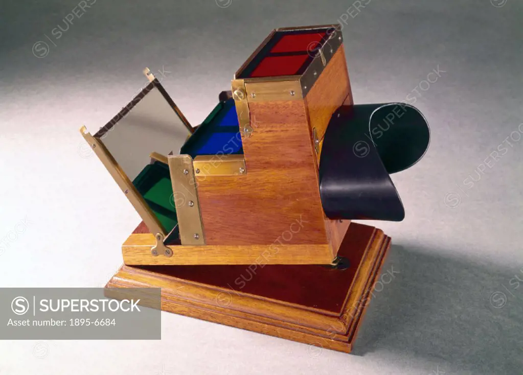 By means of this device, patented by Frederick Eugene Ives (1856-1937) in 1890, three stereoscopic positives can be viewed exactly superimposed. It ma...