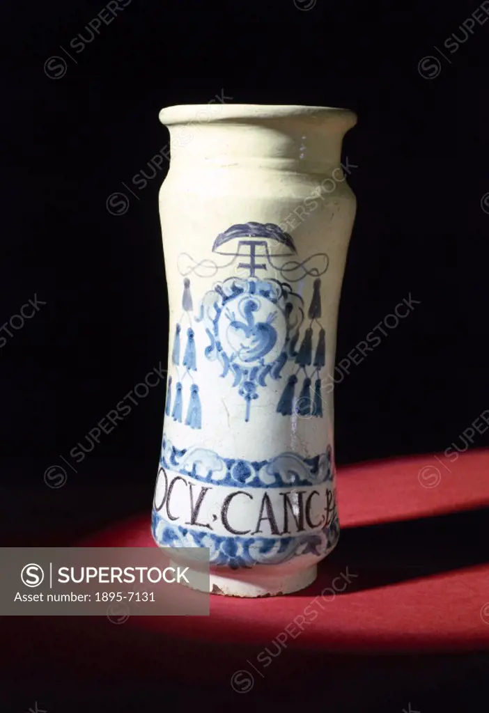 A tin-glazed earthenware cylindrical apothecarys jar, or albarello, used by Augustinians for storing crab eye ointment.
