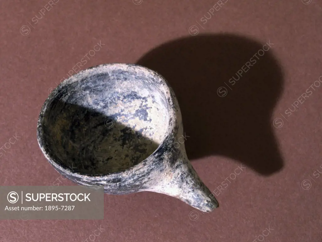 A black earthenware cup, from the grave of two children, excavated at Jebel Moya, Sudan in 1912. The Neolithic age was the last period of the Stone Ag...