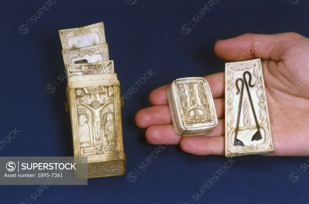 A fleam case made of bone, intricately carved with a representation of the crucifixion and the Garden of Eden, and inscribed with the name of Simon Wi...