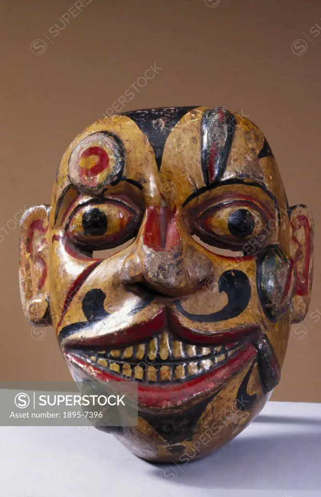 A polychrome wooden disease mask covered with sores and leeches from the kolam masked play, worn for healing rituals. In some forms of traditional med...