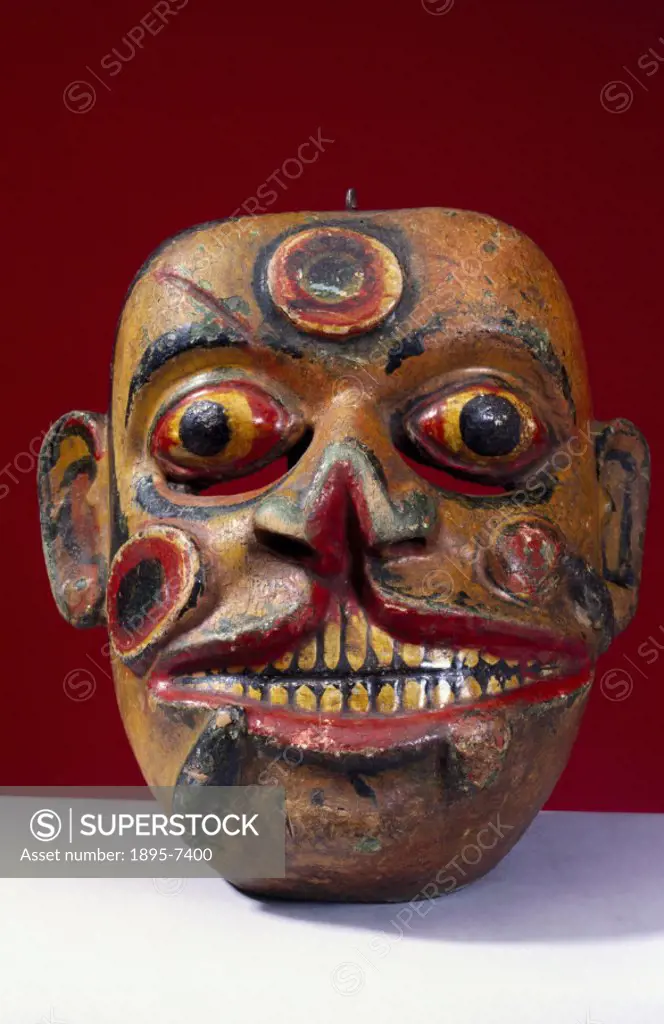 This polychrome wooden mask represents Heraya, the soldier from the kolam play, with his face covered in sores and leeches. It was worn for healing ri...