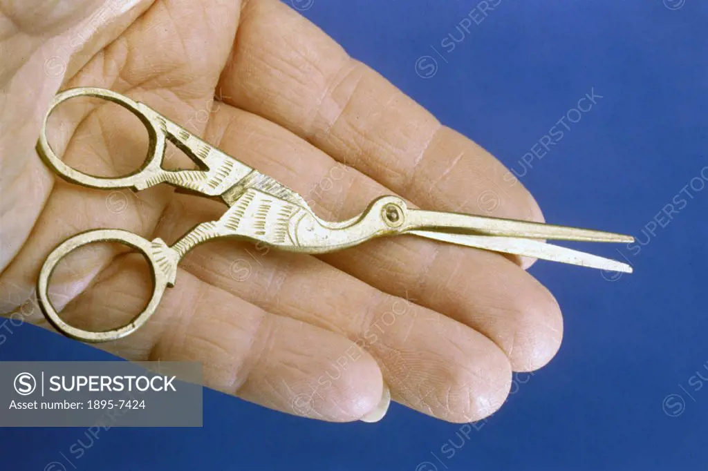 Metal scissors made to resemble a bird, possibly a stork- suggesting that they may have been designed for cutting the umblical cords of new-born child...