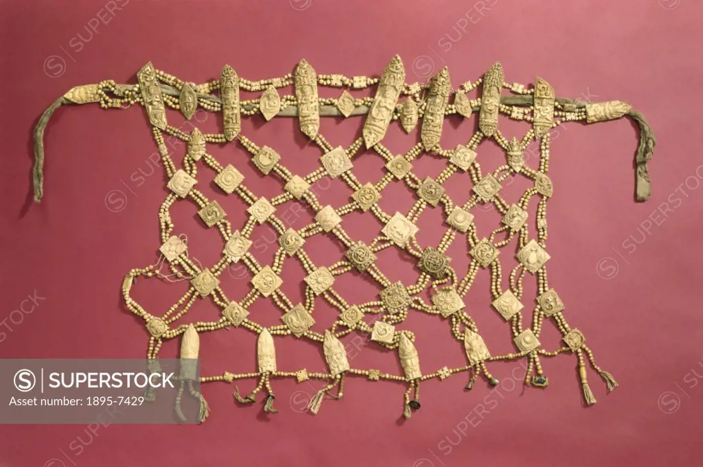 A Buddhist priest´s apron, called a nag-pa’, made with carved human bone beads strung on threads, and used in necromantic rites. In Tibetan religion ...