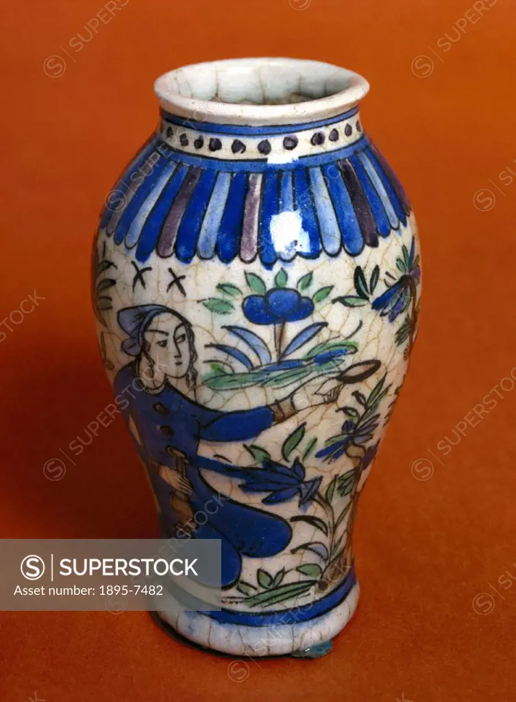 A decorated glazed earthenware pharmacy jar. Jars of this kind were used by apothecaries to store dried herbs, minerals and other medicines. The glaze...