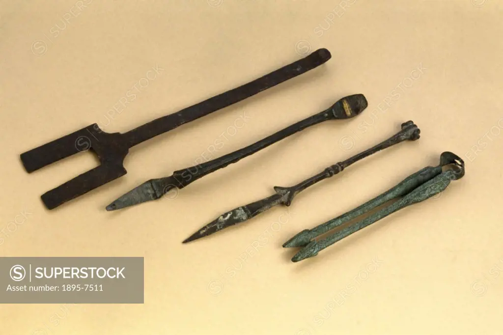 The bronze forceps with arrow-head tips, far right, are medieval and date from 500-1600 AD. The bronze spoon, handle only, is probably Italian and dat...