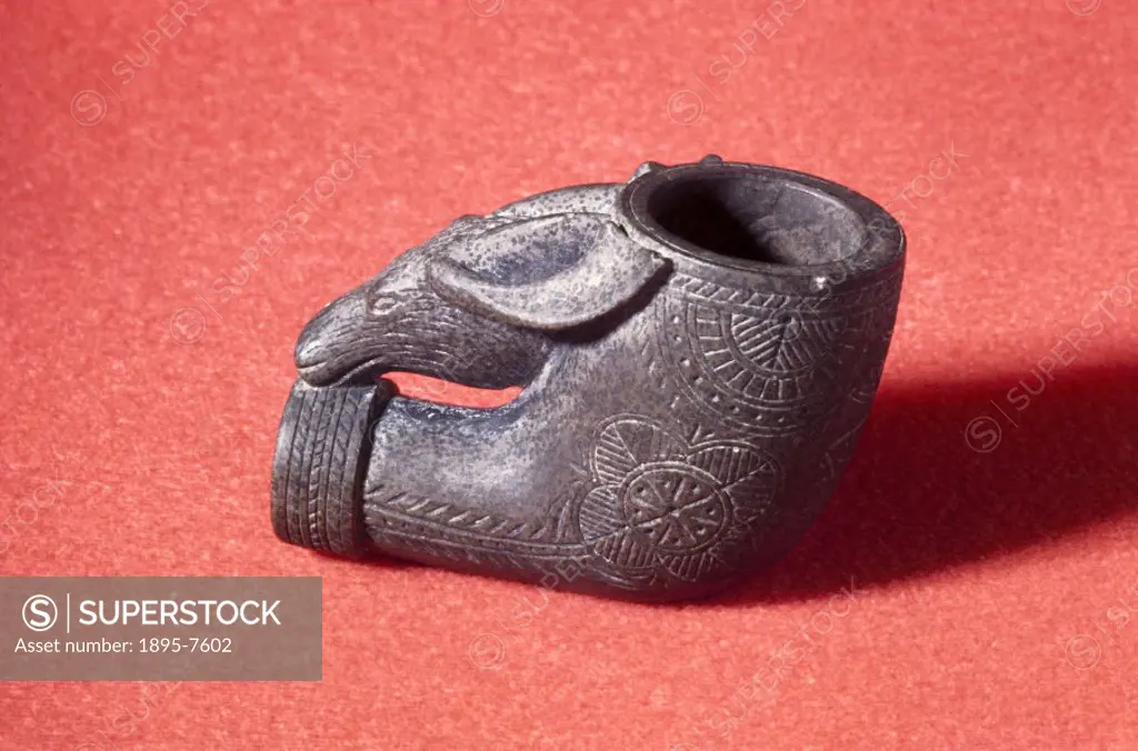 This stone pipe with a carved illustration of a moose on the front of the bowl was made by the Micmac people of Nova Scotia, Canada. The ceremonial sm...