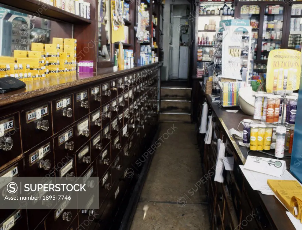 View behind the counter showing the original Victorian drawers used for storing the drugs. The Imperial Pharmacy opened in 1899.