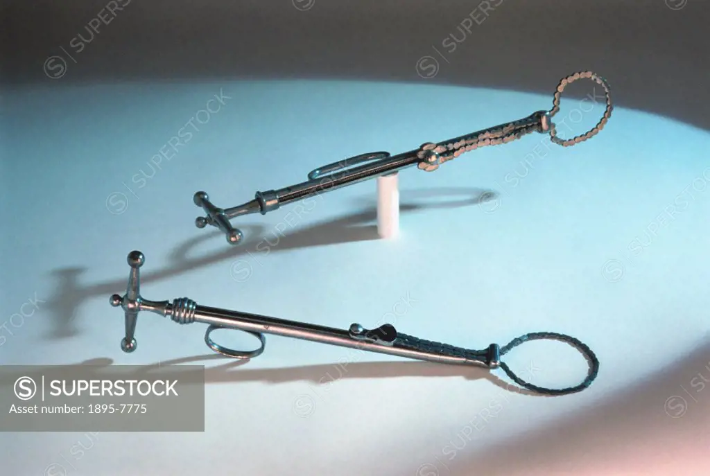 The castration device in the foreground is a steel ecraseur, manufactured by Evans & Co of London between 1867-1900. The device in the background is a...