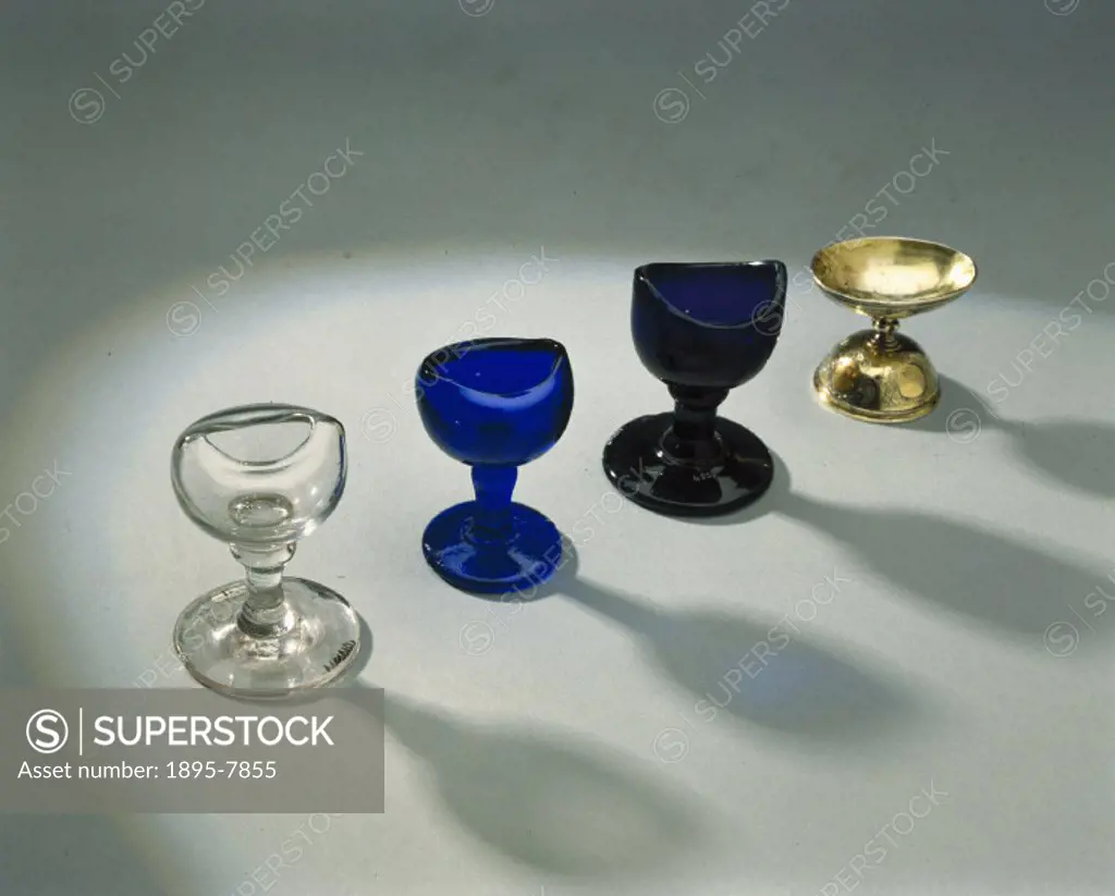 ´Left to right, these eye baths are: 19th century, clear blown glass with a stem; English, blue glass, moulded with a stem; European, 1801-1900, purpl...