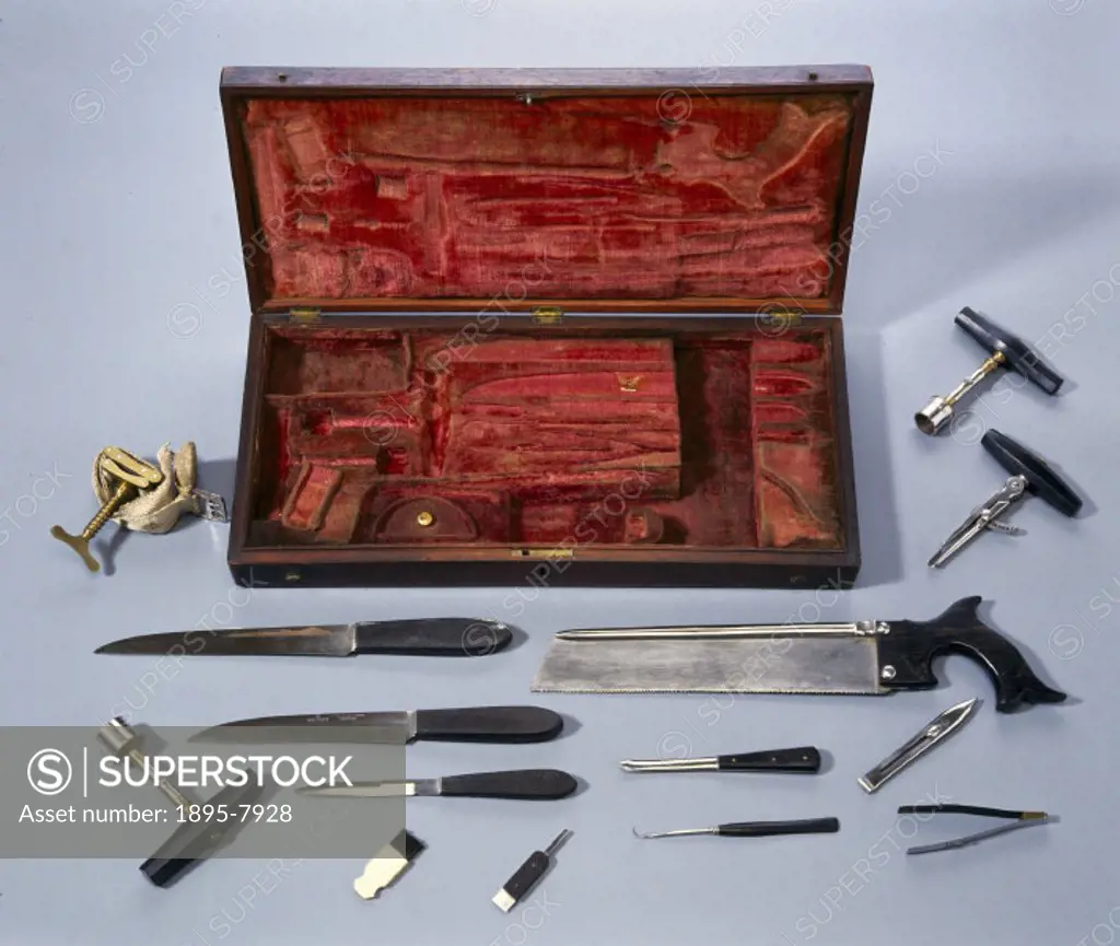 An English set of surgical instruments made by Whitford, including knives, an amputation saw and a tourniquet.