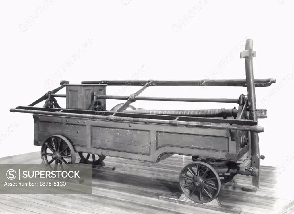 Fire engine, formerly used at Windsor Castle, and two lengths of leather hosepipes. Made by Simpson and Sons.