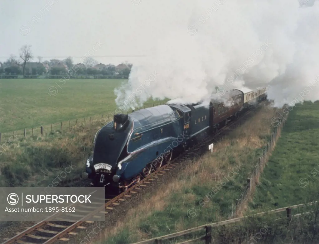 ´Mallard´ pulling a Friends of the National Railway Museum 10th anniversary special, ´The Scarborough Flyer´, at Poppleton, York, on the single line s...