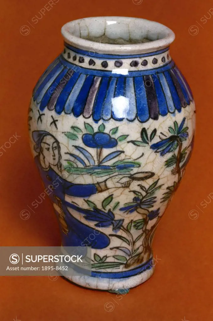 A decorated glazed earthenware pharmacy jar. Jars of this kind were used by apothecaries to store dried herbs, minerals and other medicines. The glaze...