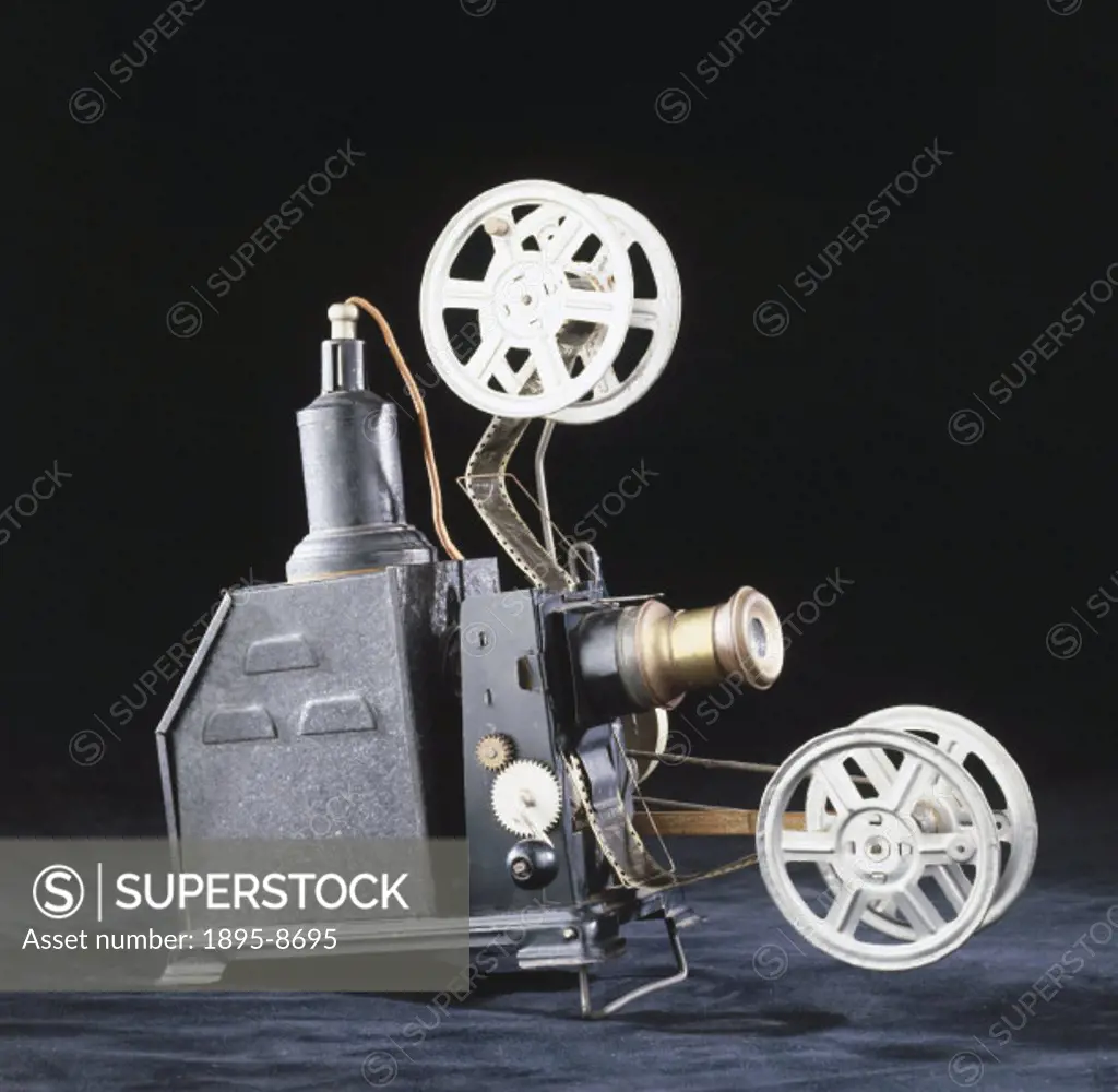 Home film projector, early 20th century. This is an example of an early hand-cranked 35mm projector, designed for use in the home. Such projectors cou...