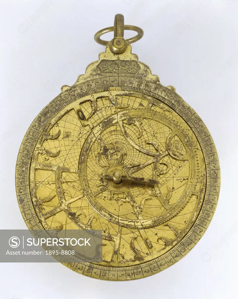 This brass Islamic astrolabe was made by Musatafa Ayyub-I in the Middle East. An astrolabe is in essence a model of the universe that an astronomer co...