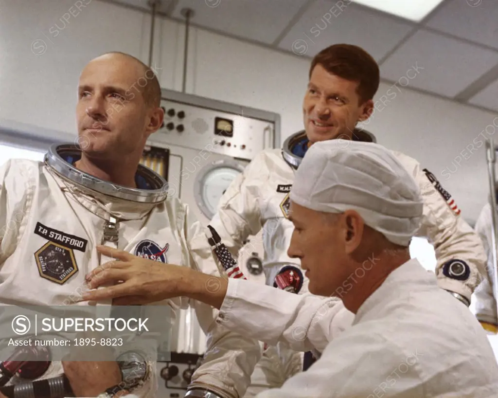 Both astronauts are in their spacesuits being attended by a technician. The Gemini programme, which commenced in 1962, was NASAs second manned spacef...