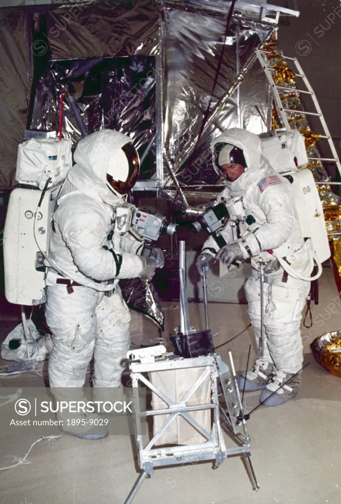 The two astronauts practising placing experiments on the Moon. Apollo 13, with astronauts Lovell, John Swigert and Haise aboard, was launched on 11th ...