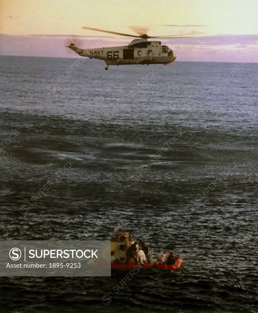 A Navy helicopter prepares to winch the Apollo 10 astronauts aboard for transfer to the recovery ship USS Princeton following splashdown in the South ...