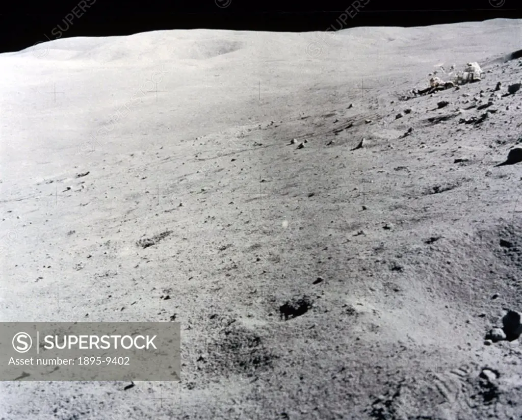 This picture, taken on one of the later Apollo manned Moon landing missions, shows a featureless, rock-strewn surface. NASA sent seven manned missions...